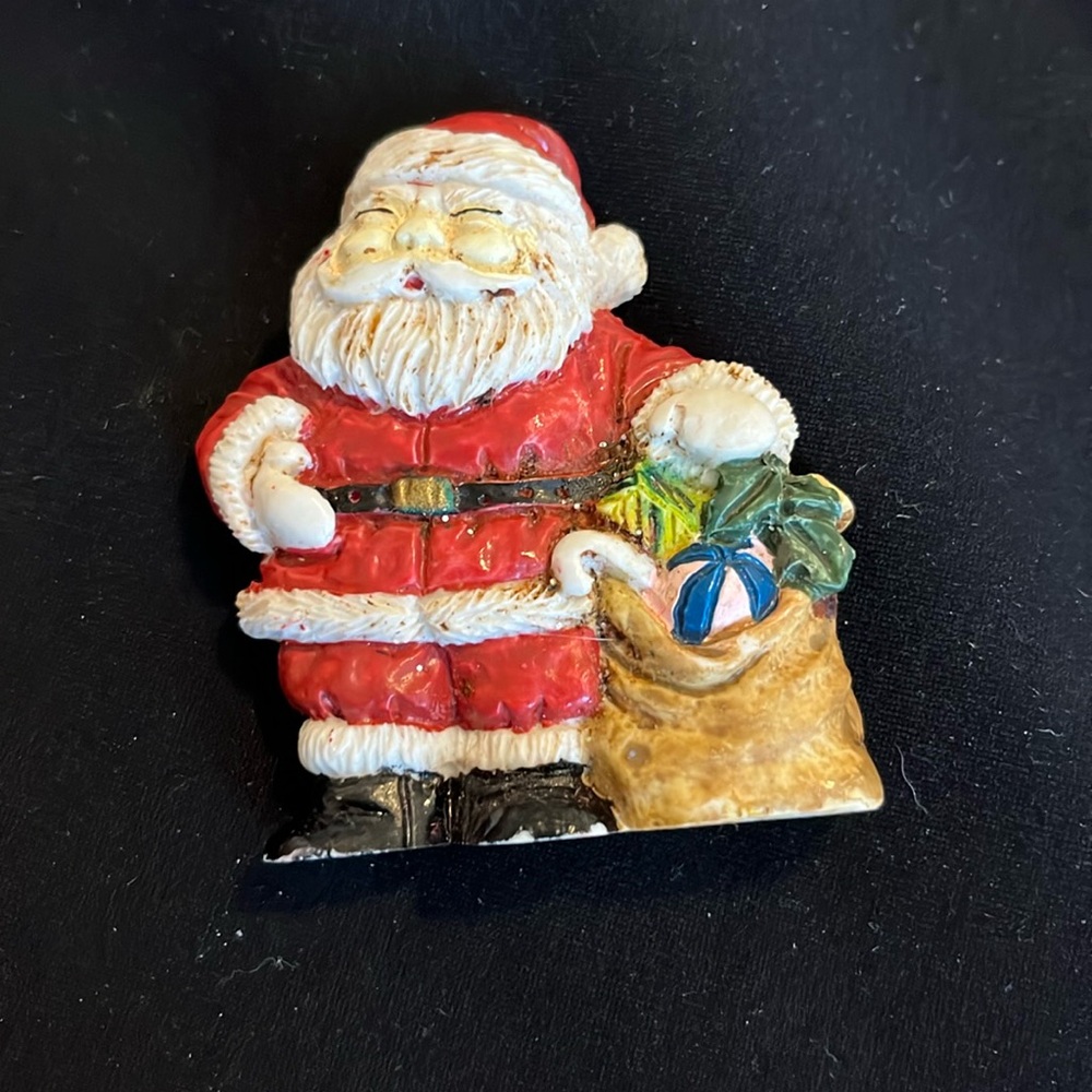 Christmas Santa Clause holding a bag of Christmas presents.
